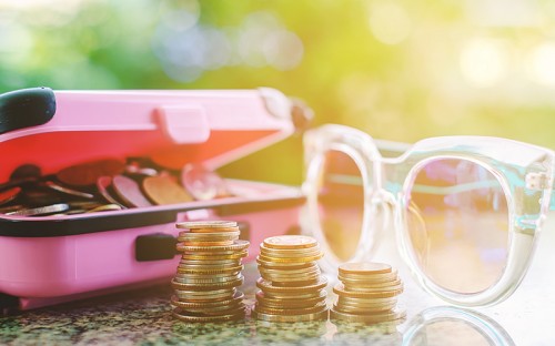 Coins and sunglasses on the table