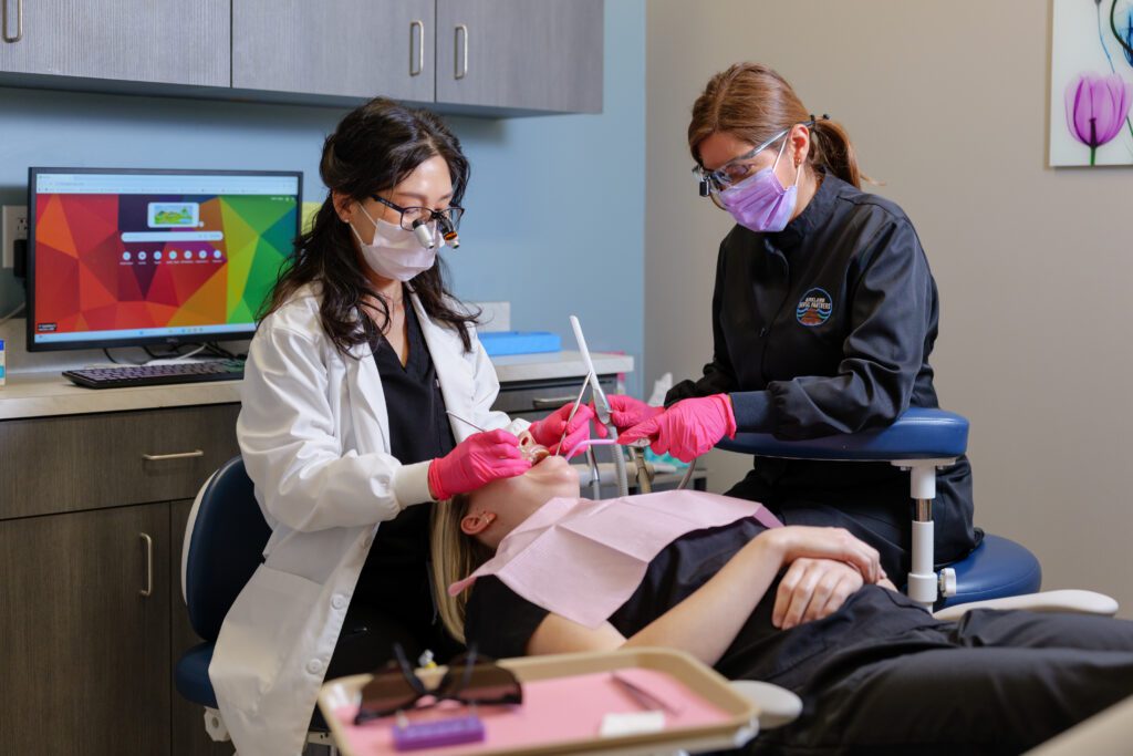 A dentist performing the dental procedure